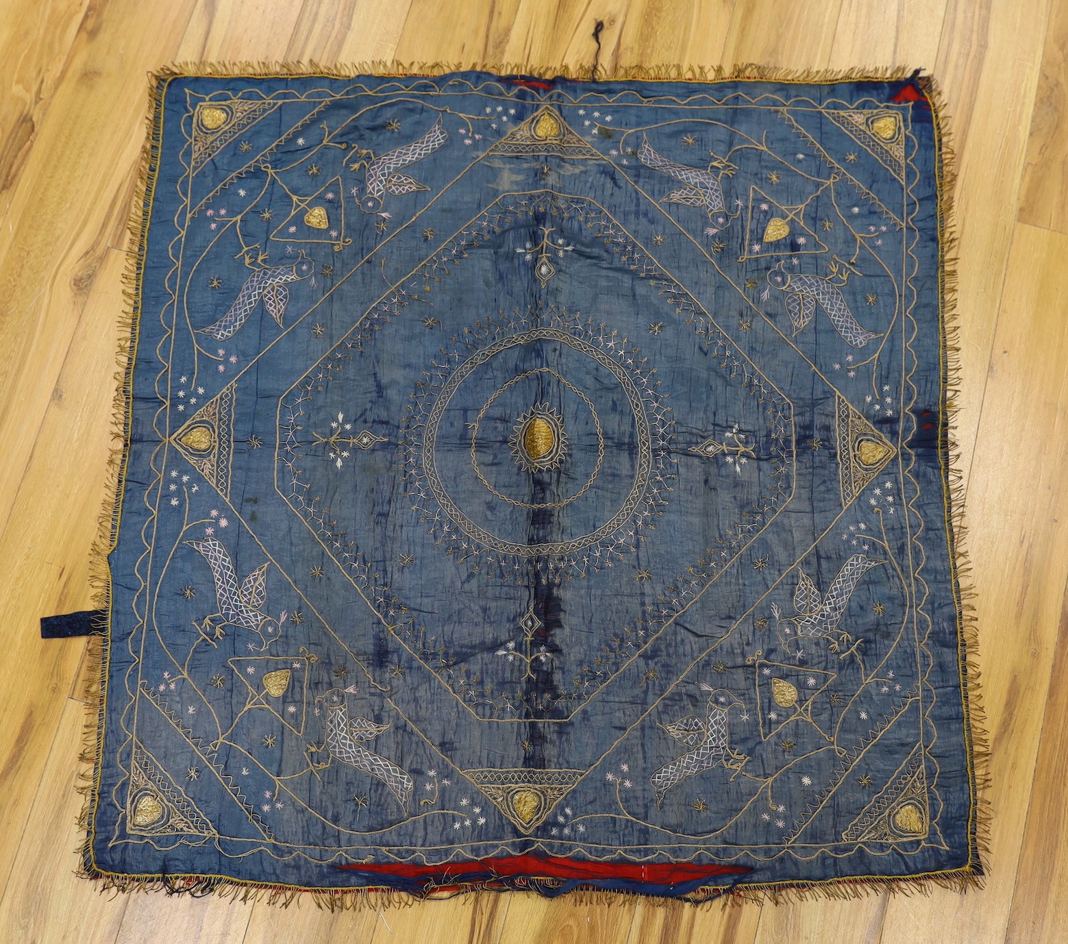 A late 19th century Indian silk and metal thread embroidered panel, approx: 118cms x118 cms